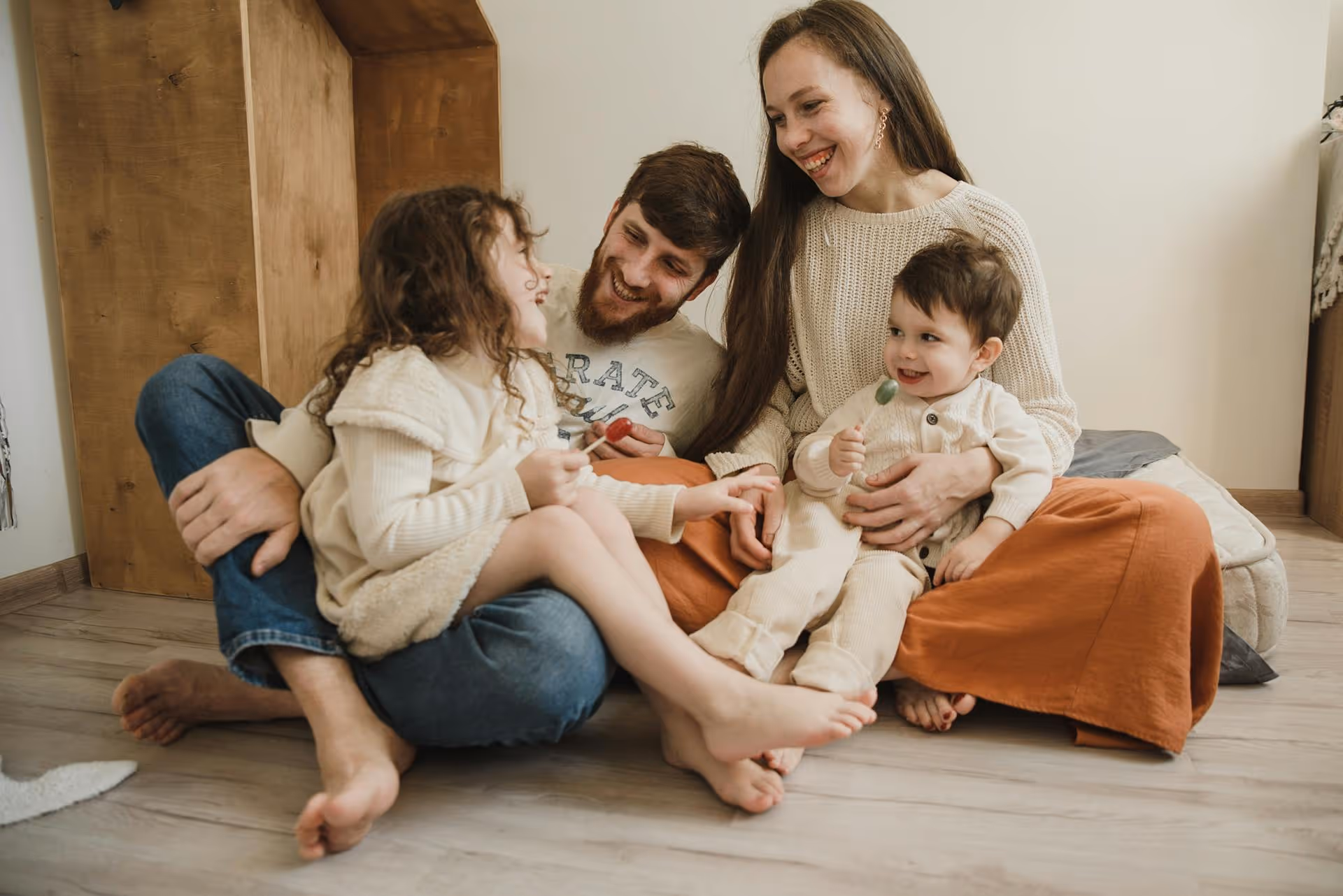 Happy family in front of their new home