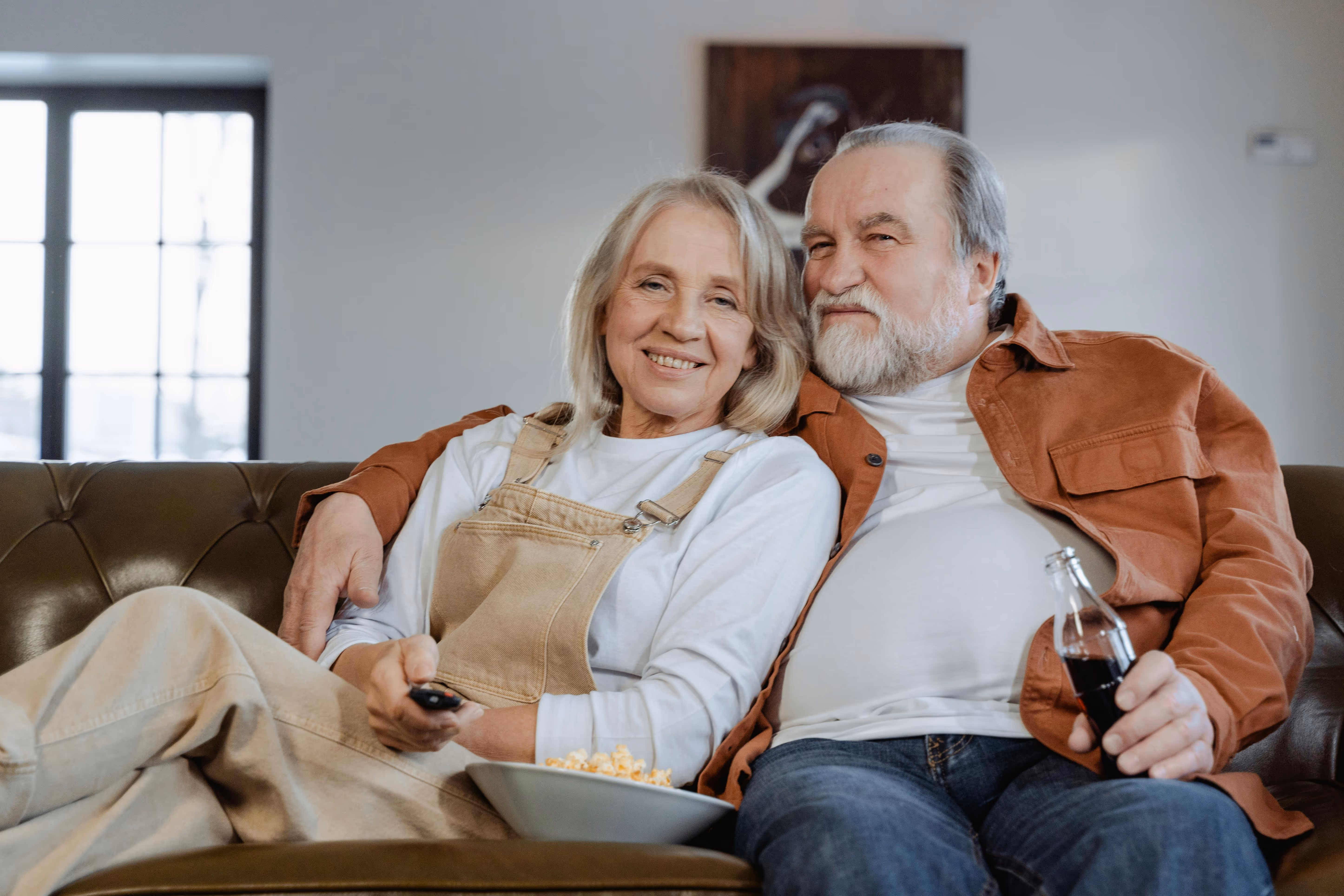 Couple relaxing on couch with peace of mind